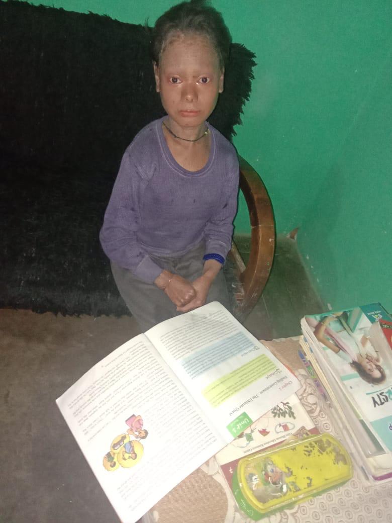 Shalini Yadav studying at a desk with open textbooks